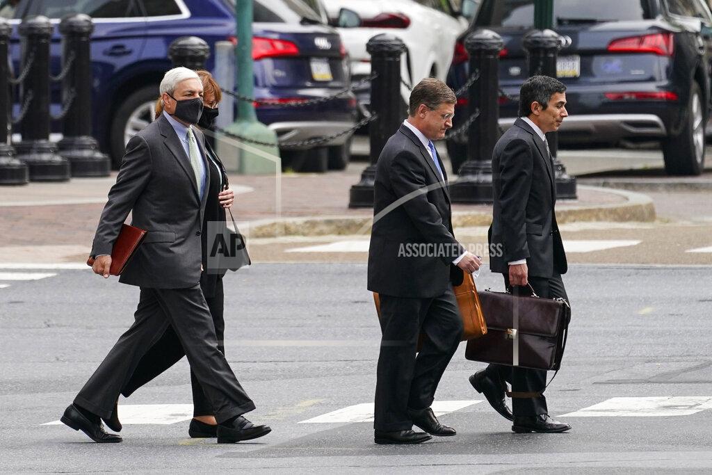 Matt Rourke Former Penn State President Graham Spanier, left, walks to his hearing at the Dauphin County Courthouse in Harrisburg, Pa., Wednesday, May 26, 2021. A judge will determine if and when Spanier must report to jail to begin serving time for a single misdemeanor conviction of endangering the welfare of children. (AP Photo/Matt Rourke)