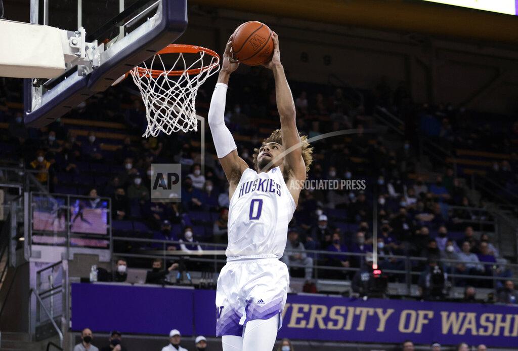 John Froschauer Washington's Emmitt Matthews Jr. goes to the basket for a dunk against Arizona State during the first half of an NCAA college basketball game Thursday, Feb. 10, 2022, in Seattle. (AP Photo/John Froschauer)