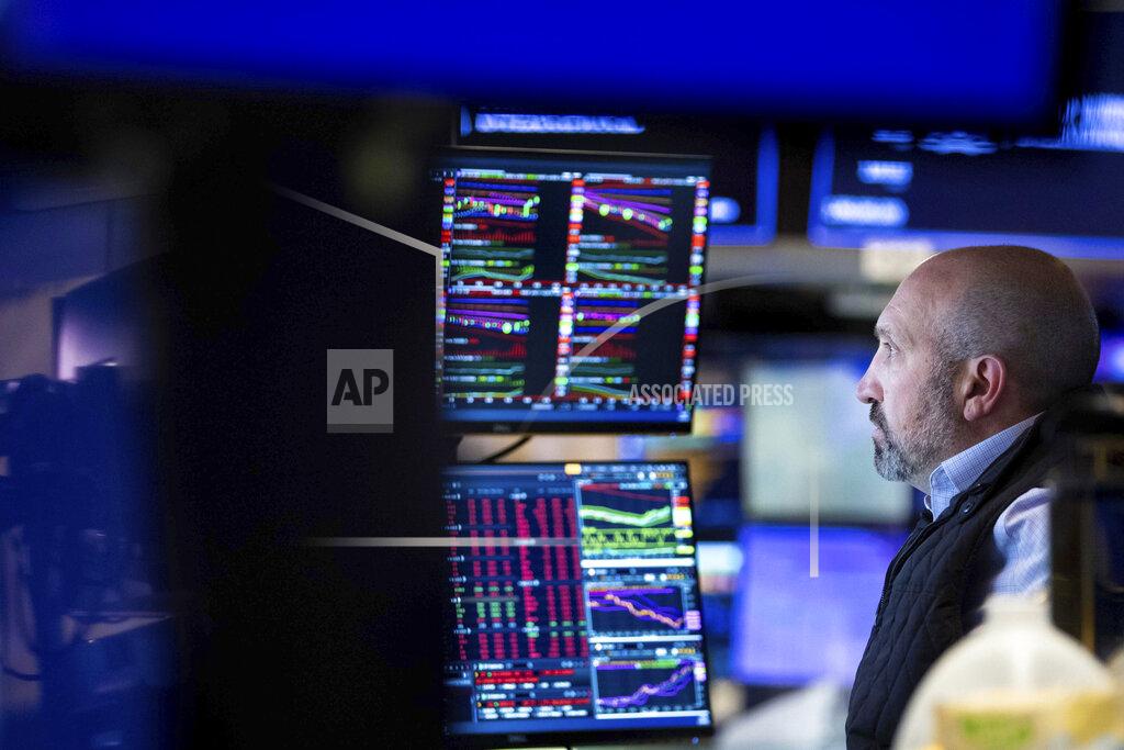Allie Joseph In this photo provided by the New York Stock Exchange, specialist James Denaro works at his post on the floor, Friday, May 20, 2022. Another drop for stocks on Friday has pushed the S&P 500 index 20% below its peak set early this year. (Allie Joseph/New York Stock Exchange via AP)