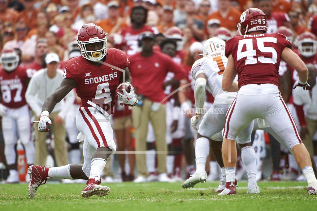 Cooper Neill Oklahoma running back Trey Sermon (4) breaks free against Texas during the second half of an NCAA college football game at the Cotton Bowl, Saturday, Oct. 6, 2018, in Dallas. (AP Photo/Cooper Neill)