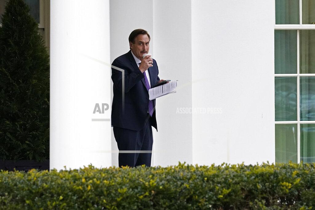 Gerald Herbert Michael Lindell, CEO of My Pillow, Inc., waits to go into the West Wing of the White House, Friday, Jan. 15, 2021, in Washington. (AP Photo/Gerald Herbert)