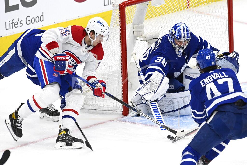 Frank Gunn Montreal Canadiens center Jesperi Kotkaniemi (15) carries the puck to the front of the net before scoring on Toronto Maple Leafs goaltender Jack Campbell (36) during the second period in Game 5 of an NHL hockey Stanley Cup first-round playoff series in Toronto on Thursday, May 27, 2021. (Frank Gunn/The Canadian Press via AP)