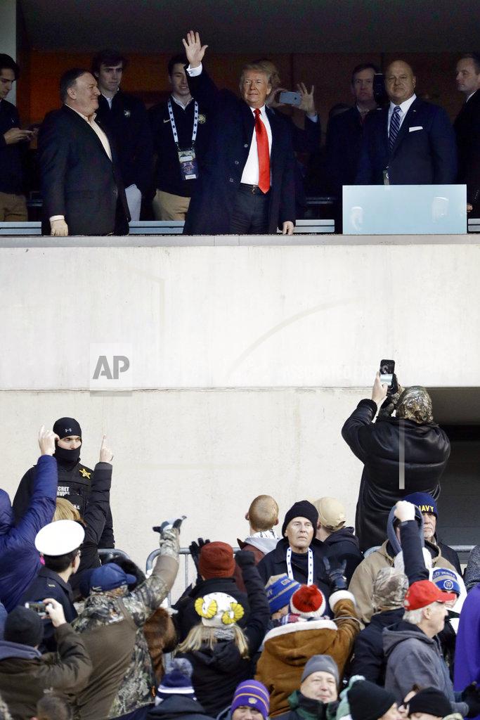 Matt Slocum President Donald Trump, top center, waves to the crowd during the first half of an NCAA college football game between Army and Navy, Saturday, Dec. 8, 2018, in Philadelphia. (AP Photo/Matt Slocum)