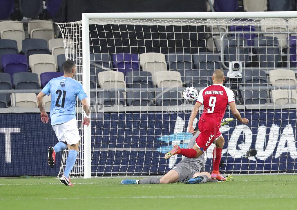 Ariel Schalit Denmark's Martin Braithwaite scores during the World Cup 2022 group F qualifying soccer match between Israel and Denmark in Tel Aviv, Israel, Thursday, March 25, 2021. (AP Photo/Ariel Schalit)