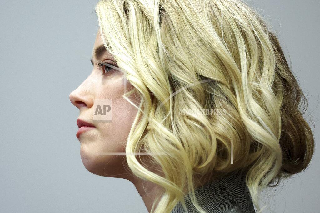 Michael Reynolds Actor Amber Heard appears in the courtroom in the Fairfax County Circuit Courthouse in Fairfax, Va., Thursday, May 26, 2022. Actor Johnny Depp sued his ex-wife Amber Heard for libel in Fairfax County Circuit Court after she wrote an op-ed piece in The Washington Post in 2018 referring to herself as a "public figure representing domestic abuse." (Michael Reynolds/Pool Photo via AP)