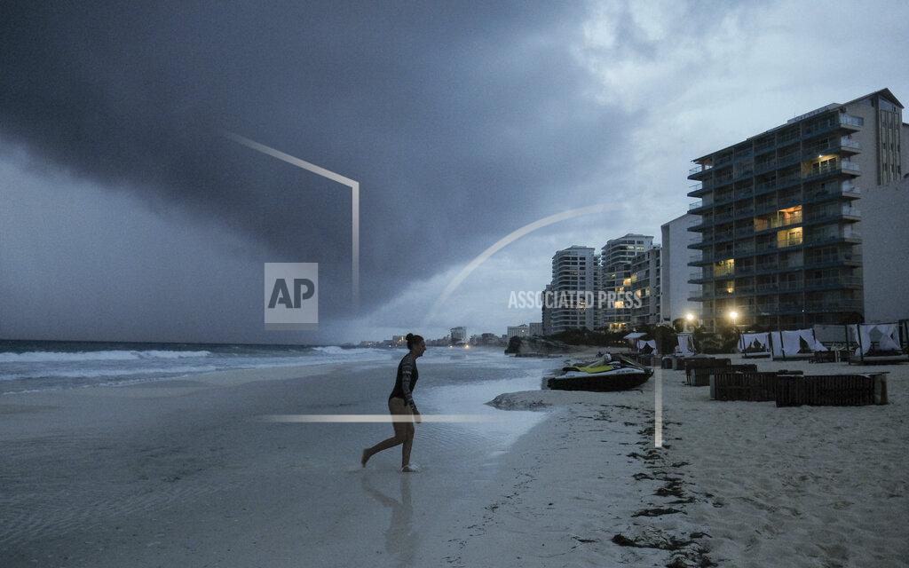 Victor Ruiz Garcia Clouds gather over Playa Gaviota Azul as Tropical Storm Zeta approaches Cancun, Mexico, Monday, Oct. 26, 2020. A strengthening Tropical Storm Zeta is expected to become a hurricane Monday as it heads toward the eastern end of Mexico's resort-dotted Yucatan Peninsula and then likely move on for a possible landfall on the central U.S. Gulf Coast at midweek. (AP Photo/Victor Ruiz Garcia)