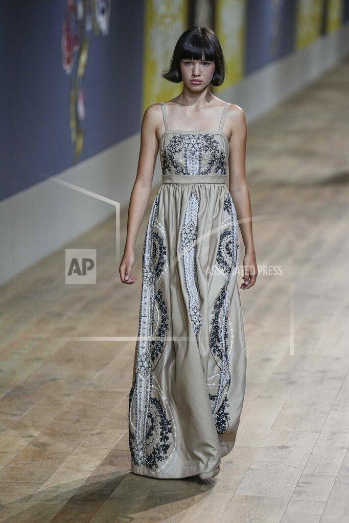 Michel Euler A model wears a creation as part of Dior's Haute Couture Fall/Winter 2022-2023 fashion collection presented Monday, July 4, 2022 in Paris. (AP Photo/Michel Euler)
