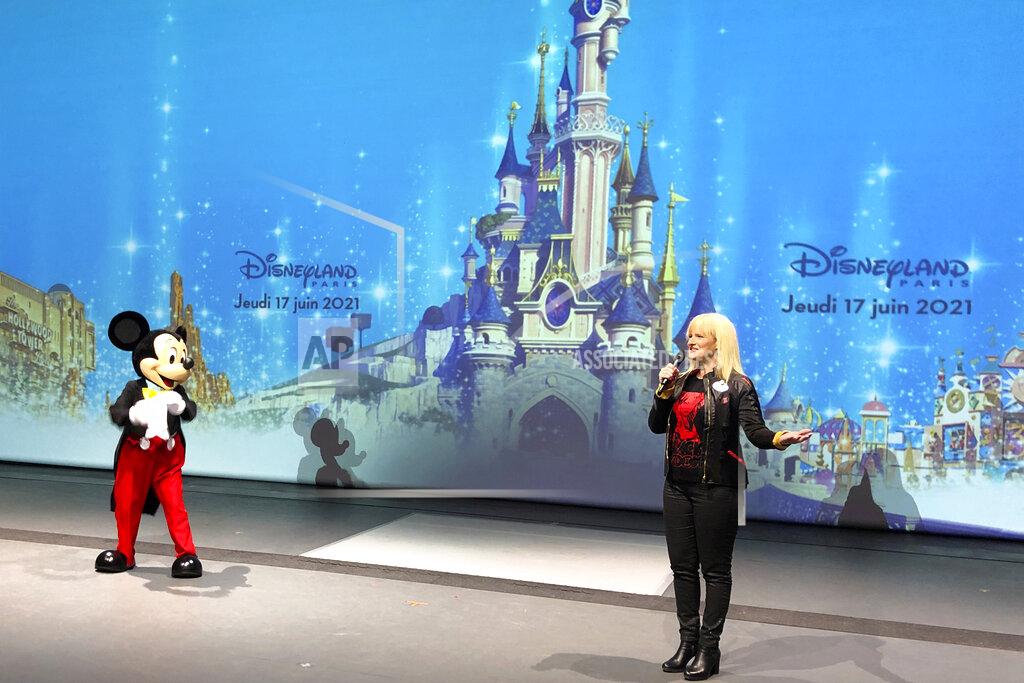 Catherine Gaschka Natacha Rafalski,,President of Disneyland Paris, delivers her speech at the theme park in Marne-la-Vallée, east of Paris, Thursday, June 17, 2021. France's tourism sector takes a further step toward post-pandemic recovery with the reopening of Disneyland Paris, two weeks after the country formally welcomed back vaccinated foreign visitors. (AP Photo/Catherine Gaschka)