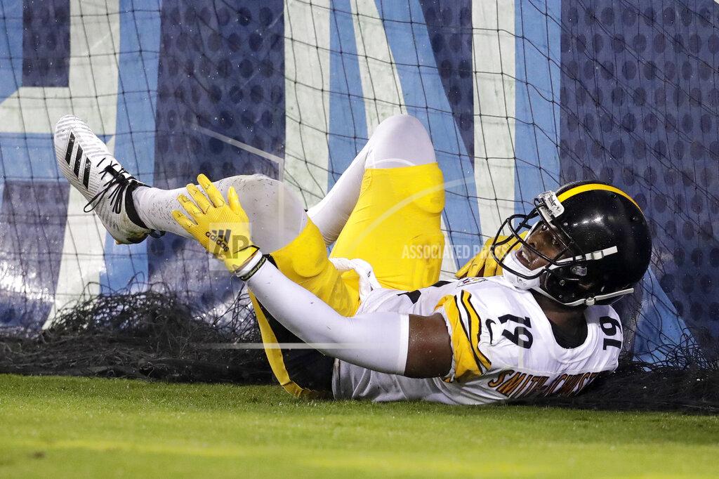Mark Zaleski Pittsburgh Steelers wide receiver JuJu Smith-Schuster slides into the padding on the stands after catching a 17-yard touchdown pass against the Tennessee Titans in the first half of a preseason NFL football game Sunday, Aug. 25, 2019, in Nashville, Tenn. (AP Photo/Mark Zaleski)