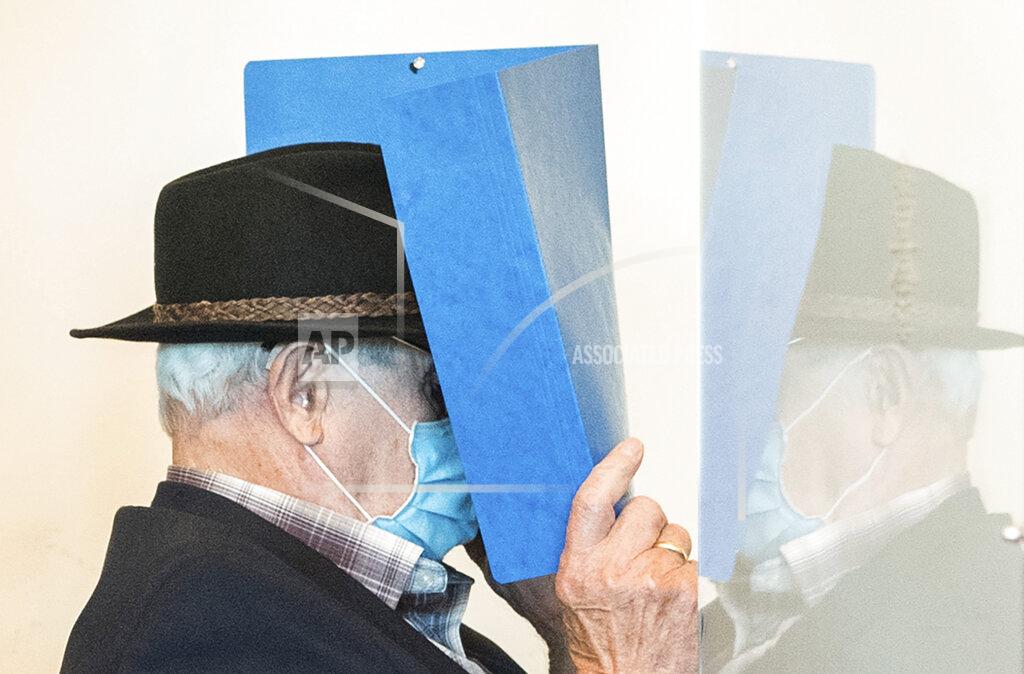 Daniel Bockwoldt A 93-year-old former SS guard of the Stutthof concentration camp near Danzig in Poland is pushed into a courtroom in the regional court in Hamburg, Germany, Thursday, July 23, 2020. The Hamburg Regional Court sentenced the former guard to two years juvenile sentence on probation. The juvenile court found him guilty of aiding and abetting murder in 5232 cases and of aiding and abetting attempted murder. (Daniel Bockwoldt/dpa via AP)
