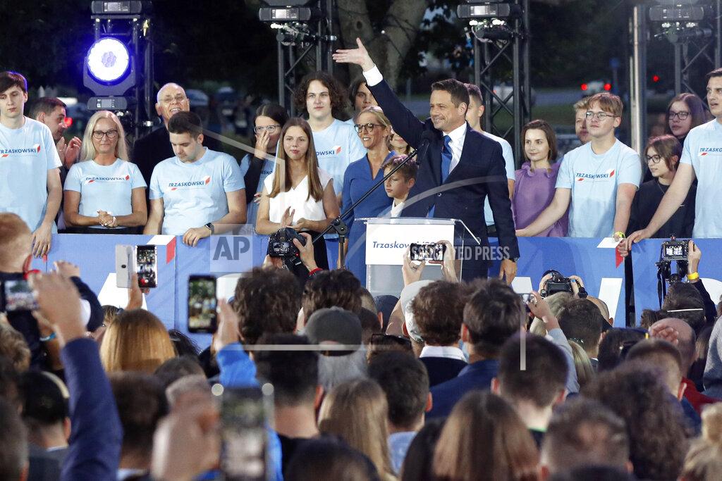 Petr David Josek Presidential candidate Rafal Trzaskowski gestures while addressing supporters at the end of the election day in Warsaw, Poland, Sunday, July 12, 2020. Voting ended in Poland's razor-blade-close presidential election runoff between the conservative incumbent Andrzej Duda and liberal, pro-European Union Warsaw Mayor Rafal Trzaskowski with exit polls showing the election is too close to call. (AP Photo/Petr David Josek)