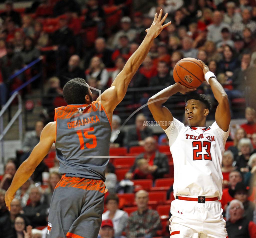 Brad Tollefson Texas Tech's Jarrett Culver (23) looks to pass the ball around Texas-Rio Grande Valley's Uche Dibiamaka (15) during the second half of an NCAA college basketball game Friday, Dec. 28, 2018, in Lubbock, Texas. (AP Photo/Brad Tollefson)