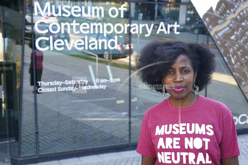 Tony Dejak La Tanya Autry, a curatorial fellow at The Museum of Contemporary Art Cleveland, poses outside of the museum in Cleveland on Thursday, Oct. 8, 2020. Museums are being called on to examine what's on their walls amid a national reckoning on racism. Among 18 major U.S. museums, 85% of artists featured are white, while 87% are men, according to a 2019 study conducted at Williams College. Autry helped start an initiative called Museums Are Not Neutral. (AP Photo/Tony Dejak)