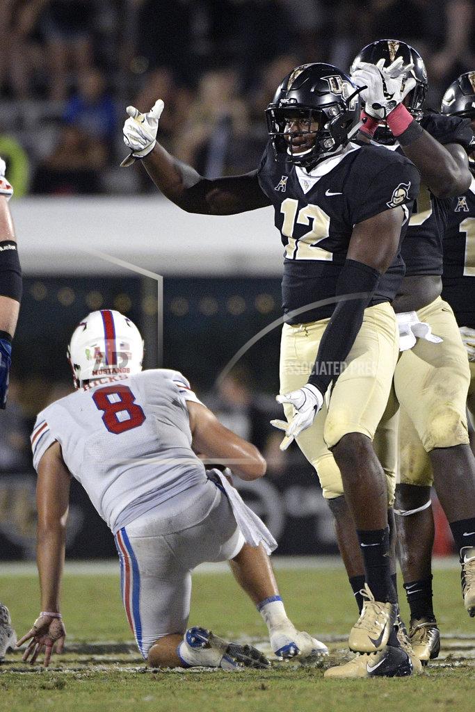 Phelan M. Ebenhack Central Florida linebacker Eric Mitchell (12) celebrates after sacking SMU quarterback Ben Hicks (8) during the second half of an NCAA college football game Saturday, Oct. 6, 2018, in Orlando, Fla. UCF won 48-20. (AP Photo/Phelan M. Ebenhack)