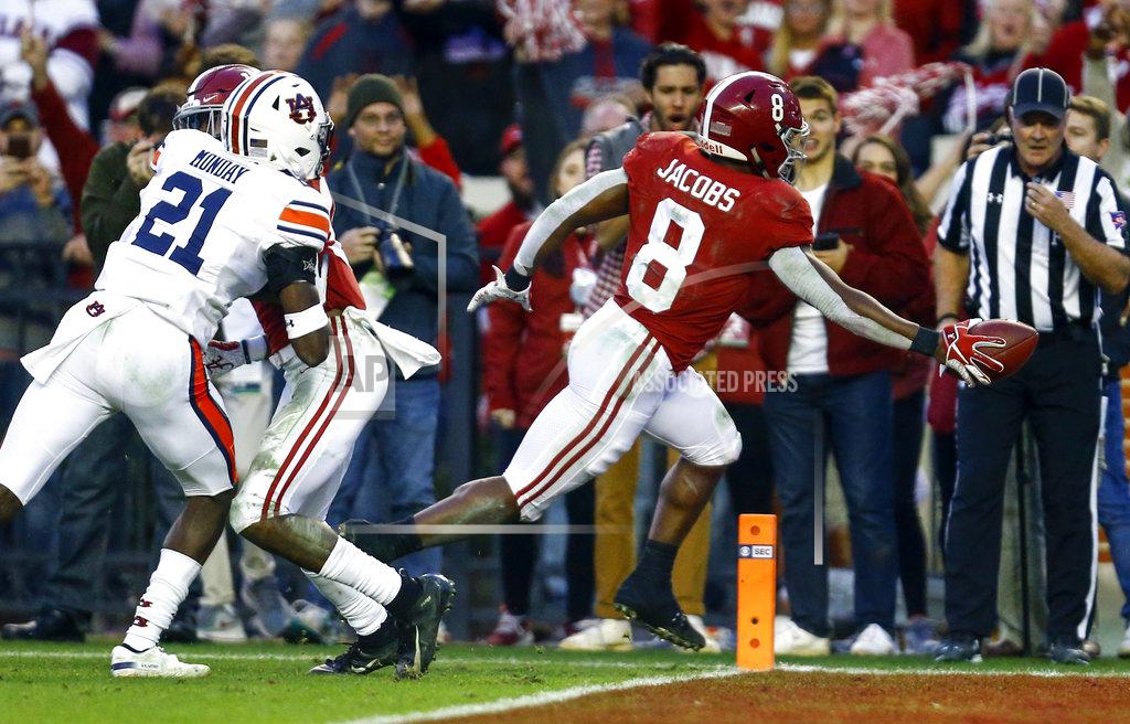Butch Dill Alabama running back Josh Jacobs (8) carries the ball in for a touchdown against Auburn during the second half of an NCAA college football game, Saturday, Nov. 24, 2018, in Tuscaloosa, Ala. (AP Photo/Butch Dill)