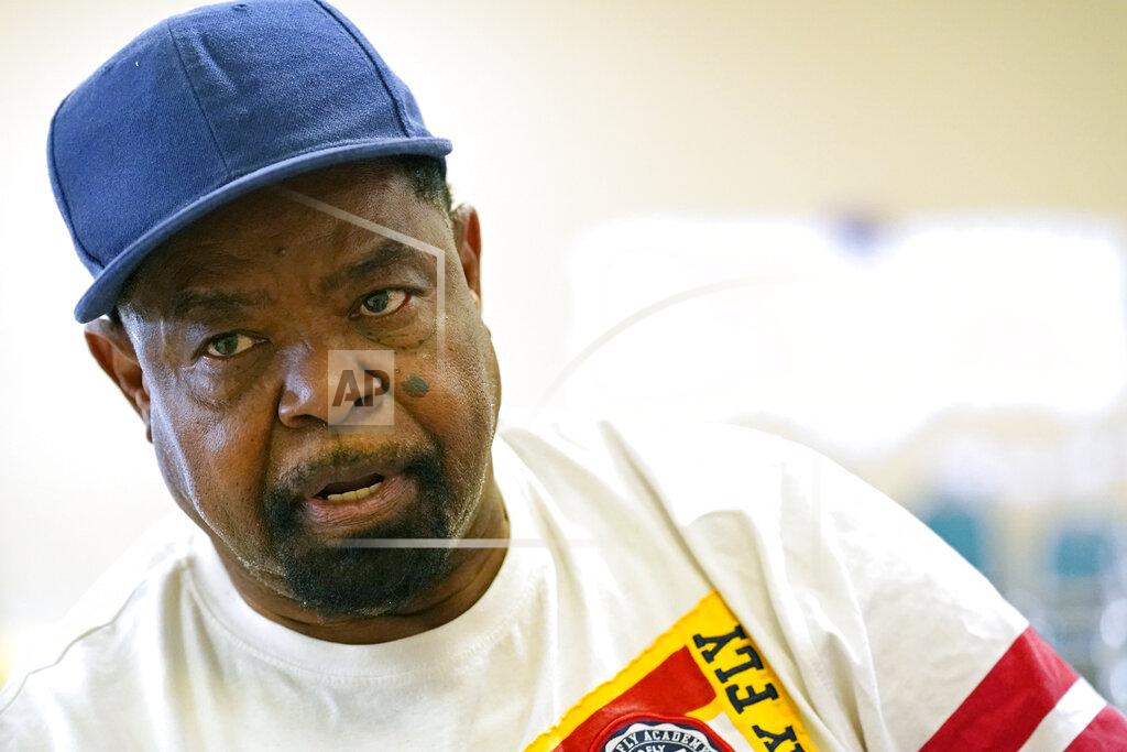Rogelio V. Solis Wilbert Marshall, 71, speaks about his receiving the COVID-19 vaccine, while waiting for a transportation bus at the Rev. S.L.A. Jones Activity Center for the Elderly to take him and other seniors to the Aaron E. Henry Community Health Service Center to receive their vaccinations, Wednesday, April 7, 2021, in Clarksdale, Miss. The Mississippi Department of Human Services is in the initial stages of teaming up with community senior services statewide to help older residents get vaccinated. (AP Photo/Rogelio V. Solis)