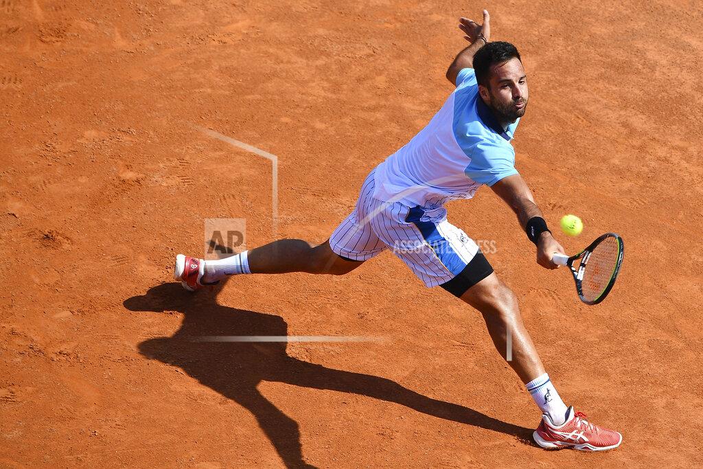 Alfredo Falcone Italy's Salvatore Caruso returns the ball to Serbia's Novak Djokovic, at the Italian Open tennis tournament in Rome, Wednesday, Sept. 16, 2020. (Alfredo Falcone/LaPresse via AP)