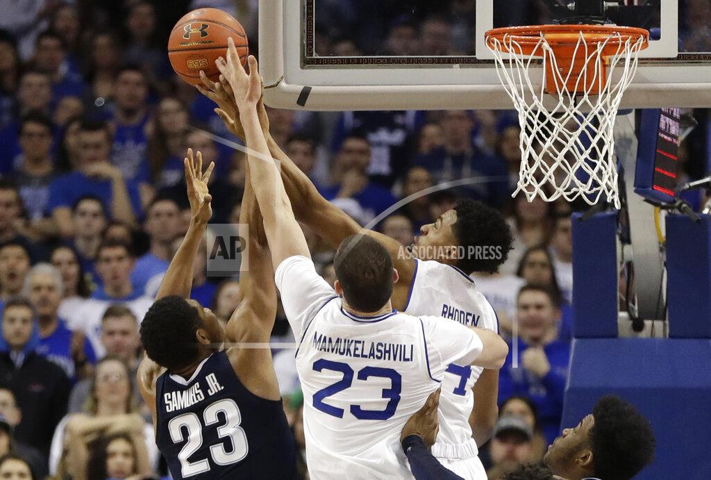 Kathy Willens Seton Hall guard Jared Rhoden (14) and forward Sandro Mamukelashvili (23) tip the ball away from Villanova forward Jermaine Samuels (23) during the second half of an NCAA college basketball game, Saturday, March 9, 2019, in Newark, N.J. Seton Hall defeated Villanova 79-75. (AP Photo/Kathy Willens)