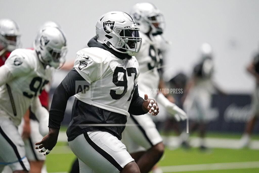 Las Vegas Raiders defensive tackle Maliek Collins (97) warms up during an NFL football training camp practice Thursday, Aug. 20, 2020, in Henderson, Nev. (AP Photo/John Locher, Pool)