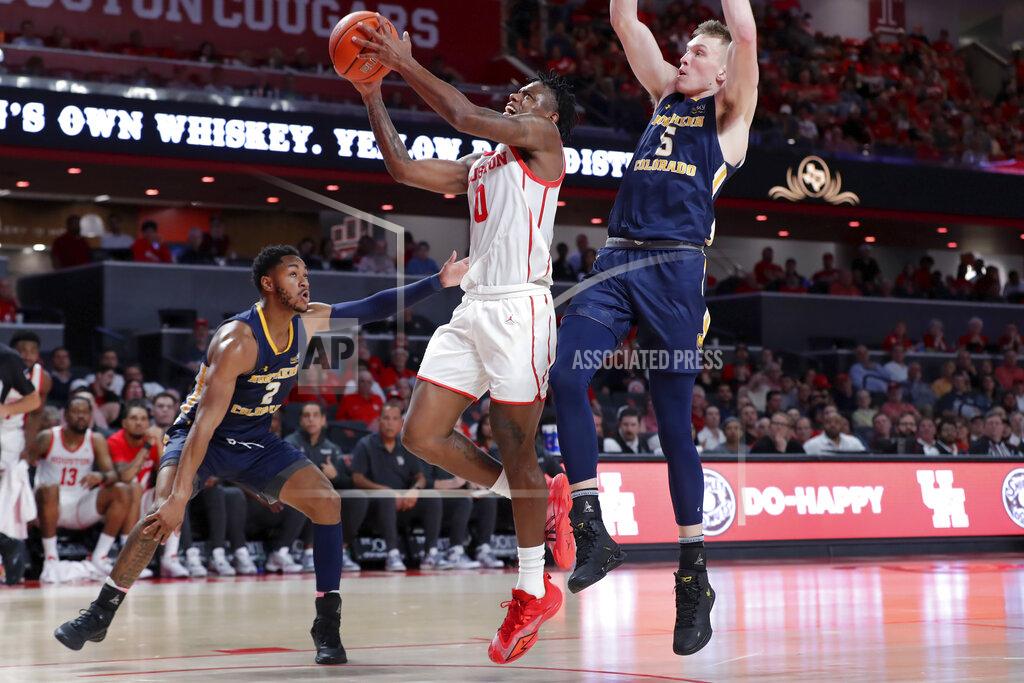Michael Wyke Houston guard Marcus Sasser (0) shoots between Northern Colorado guards Matt Johnson II (2) and Dalton Knecht (5) during the second half of an NCAA college basketball game Monday, Nov. 7, 2022, in Houston. (AP Photo/Michael Wyke)