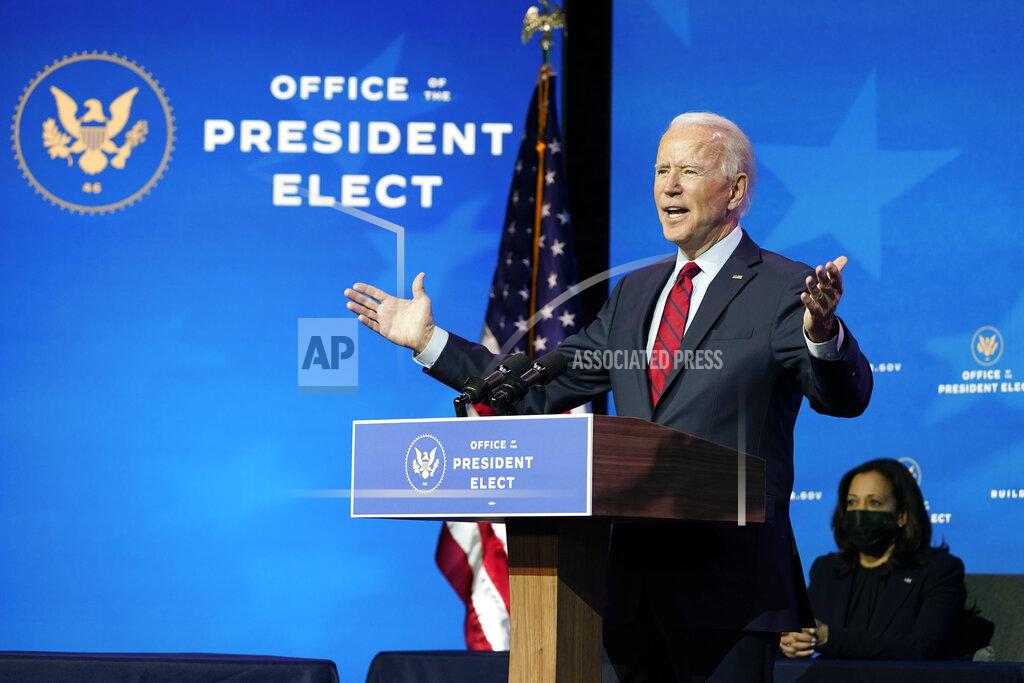 Susan Walsh President-elect Joe Biden speaks during an event at The Queen theater in Wilmington, Del., Tuesday, Dec. 8, 2020, to announce his health care team. Vice President-elect Kamala Harris listens at right. (AP Photo/Susan Walsh)