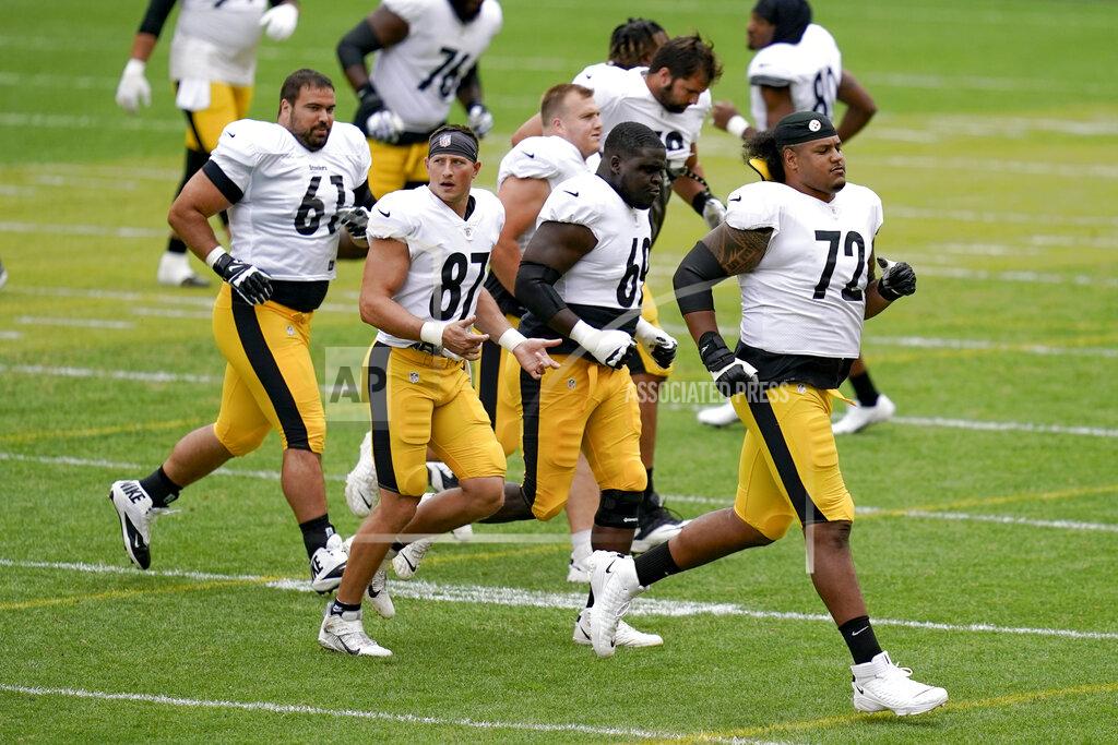 FILE - Pittsburgh Steelers offensive tackle Zach Banner (72) warms up with the offense during an NFL football training camp practice, Monday, Aug. 31, 2020, in Pittsburgh. Banner grew tired of being too big, too slow and too sloppy to become an NFL starter. The Pittsburgh Steelers newly minted right tackle credits a new mindset and a new body for his evolution from project to the first string. (AP Photo/Keith Srakocic, File)