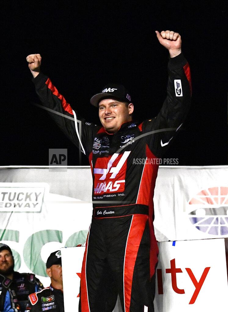 Timothy D. Easley Cole Custer raises his hands in victory following the NASCAR Xfinity Series auto race at Kentucky Speedway in Sparta, Ky., Friday, July 12, 2019. (AP Photo/Timothy D. Easley)