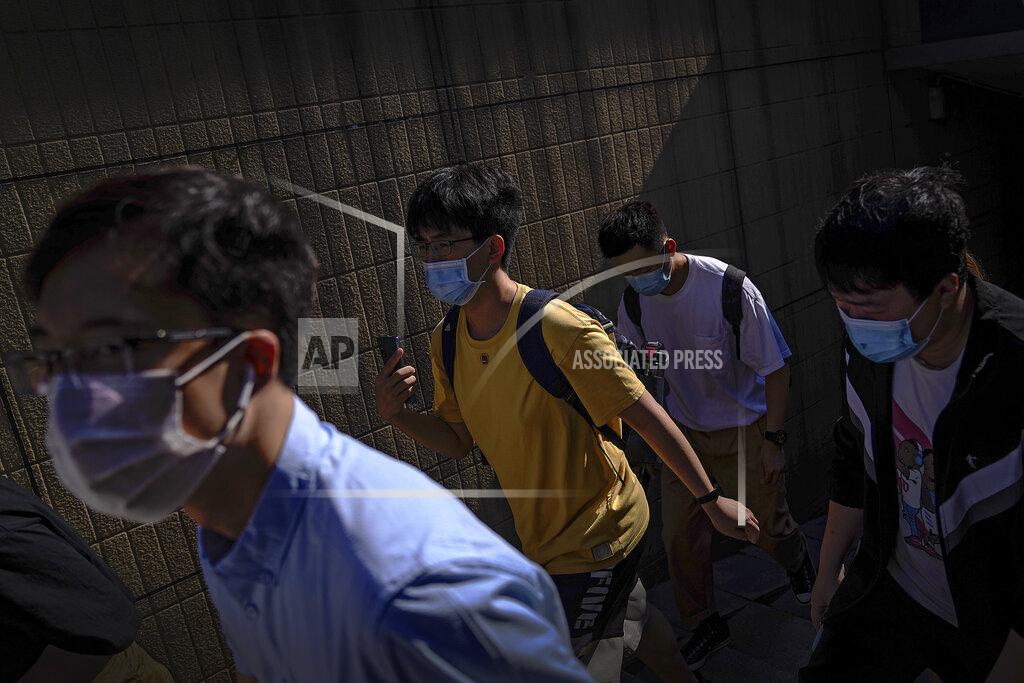 Andy Wong People wearing face masks to help curb the spread of the coronavirus walks out of an underpass tunnel as they head to work in Beijing, Thursday, June 10, 2021. (AP Photo/Andy Wong)
