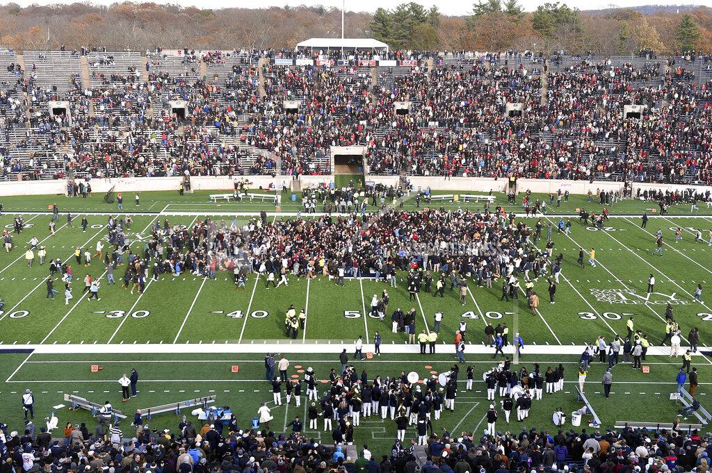 Arnold Gold Demonstrators stage a climate change protest at the Yale Bowl delaying the start of the second half of an NCAA college football game between Harvard and Yale Saturday, Nov. 23, 2019, in in New Haven, Conn. (Arnold Gold/New Haven Register via AP)
