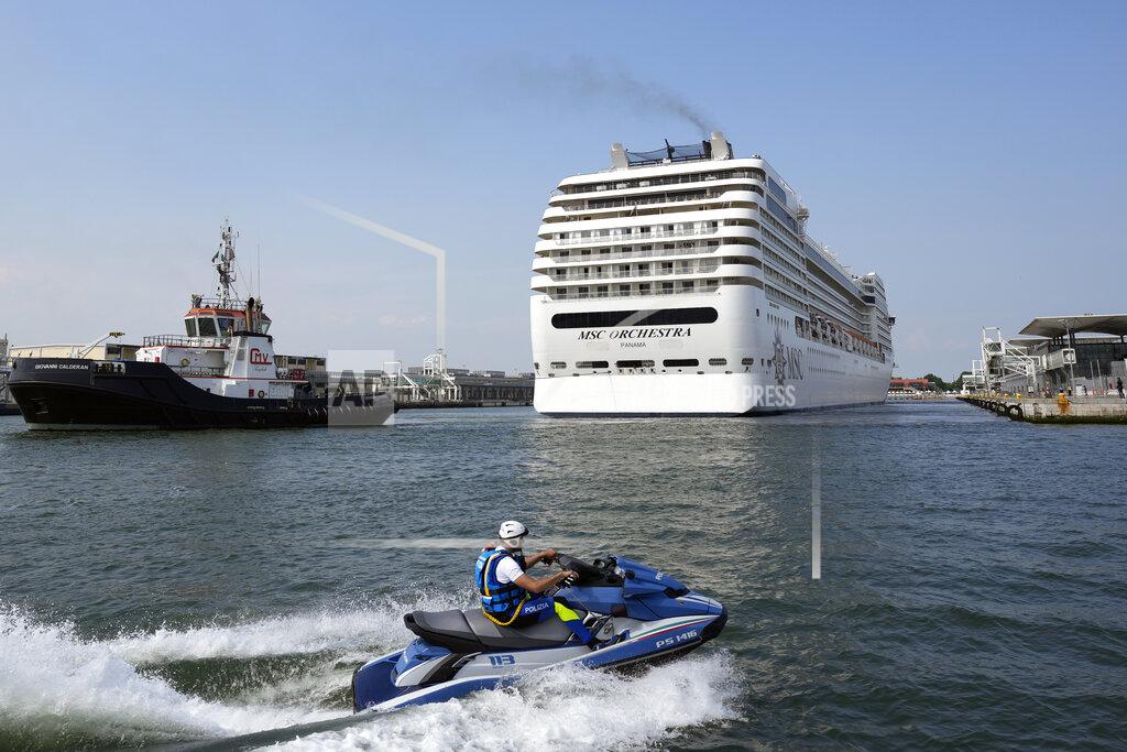 Antonio Calanni The the 92,409-ton, 16-deck MSC Orchestra cruise ship exits the lagoon as it leaves Venice, Italy, Saturday, June 5, 2021. The first cruise ship leaving Venice since the pandemic is set to depart Saturday amid protests by activists demanding that the enormous ships be permanently rerouted out the fragile lagoon, especially Giudecca Canal through the city's historic center, due to environmental and safety risks. (AP Photo/Antonio Calanni)