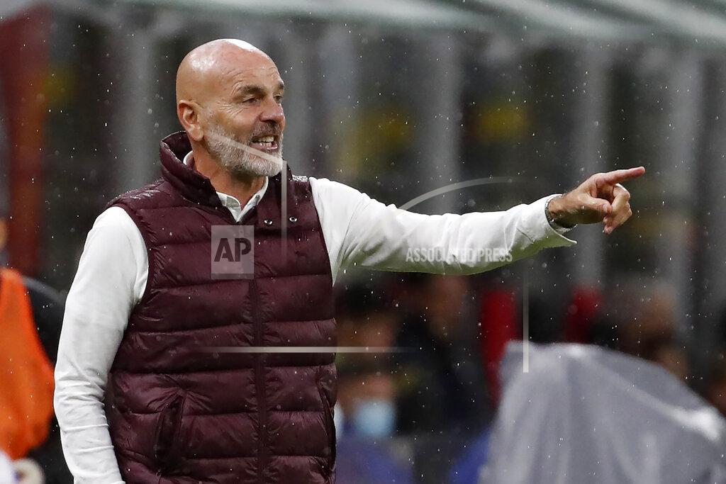 Antonio Calanni AC Milan's manager Stefano Pioli reacts during the Serie A soccer match between AC Milan and Spezia at the San Siro stadium, in Milan, Italy, Sunday, Oct. 4, 2020. (AP Photo/Antonio Calanni)
