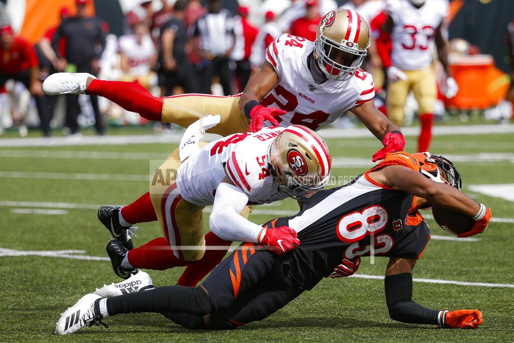 Frank Victores Cincinnati Bengals wide receiver Tyler Boyd (83) is tackled by San Francisco 49ers middle linebacker Fred Warner (54) and defensive back K'Waun Williams (24) during the second half an NFL football game, Sunday, Sept. 15, 2019, in Cincinnati. (AP Photo/Frank Victores)