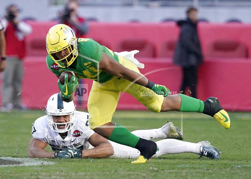 Tony Avelar Oregon running back CJ Verdell (34) breaks a tackle by Michigan State safety Khari Willis (27) during the second half of the Redbox Bowl NCAA college football game Monday, Dec. 31, 2018, in Santa Clara, Calif. Oregon won 7-6. (AP Photo/Tony Avelar)