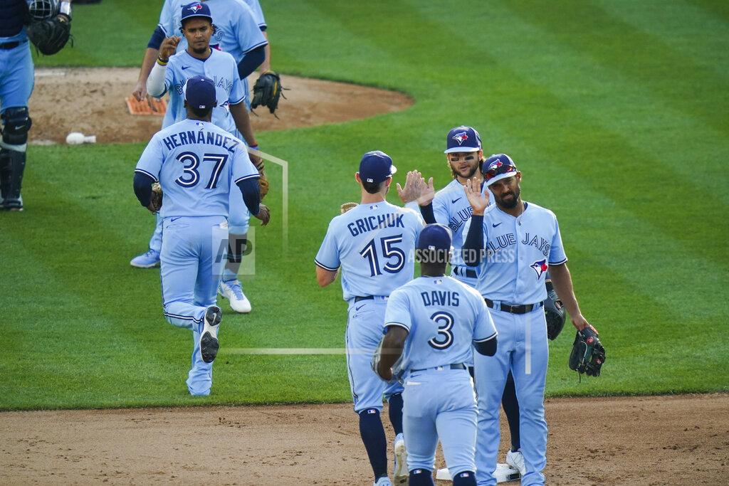 Frank Franklin Ii Toronto Blue Jays' Marcus Semien, right, and Bo Bichette, second from right, celebrates with teammates after the first game of a baseball doubleheader against the New York Yankees Thursday, May 27, 2021, in New York. The Blue Jays won 2-0.(AP Photo/Frank Franklin II)