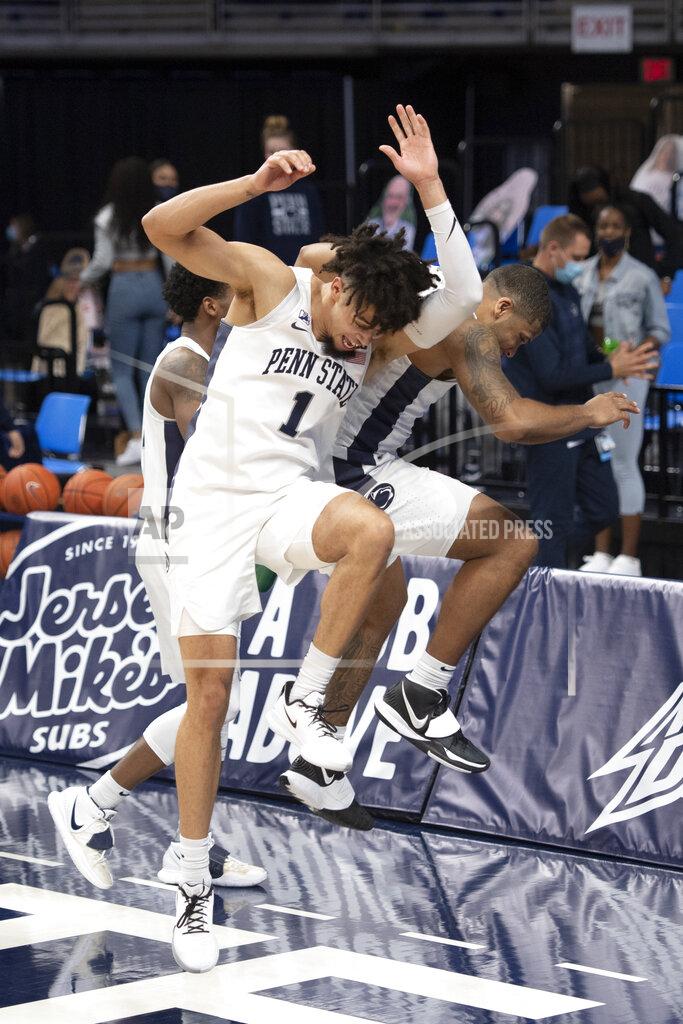 Noah Riffe Penn State forward Seth Lundy (1) and guard Myles Dread (2) celebrate after the team's NCAA college basketball game against Minnesota on Wednesday, March 3, 2021, in State College, Pa. (Noah Riffe/Centre Daily Times via AP)