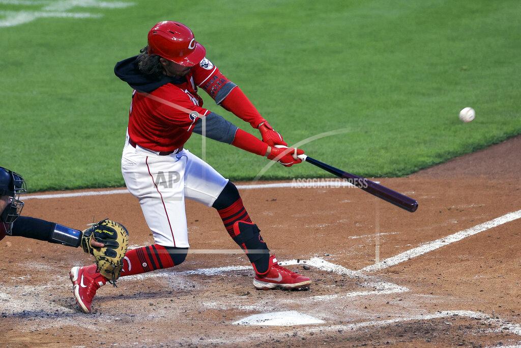 Aaron Doster Cincinnati Reds' Jonathan India hits an RBI sacrifice fly during the fourth inning of a baseball game against the Arizona Diamondbacks in Cincinnati, Wednesday, April 21, 2021. (AP Photo/Aaron Doster)