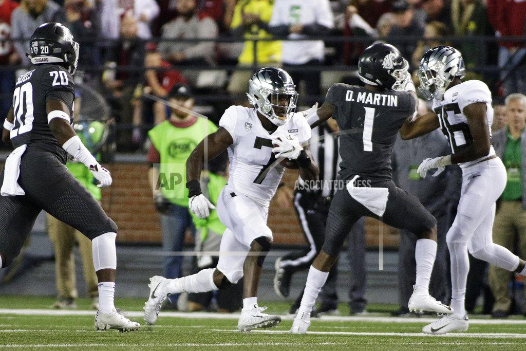 Young Kwak Oregon safety Ugochukwu Amadi (7) returns a punt during the second half of an NCAA college football game against Washington State in Pullman, Wash., Saturday, Oct. 20, 2018. Washington State won 34-20. (AP Photo/Young Kwak)