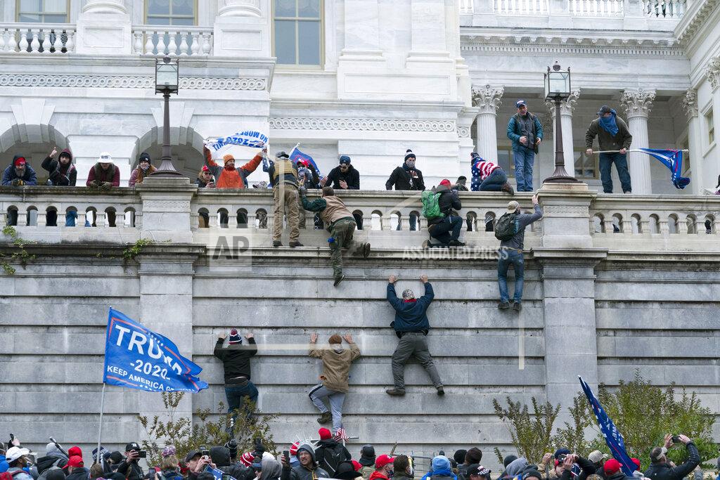 Jose Luis Magana Supporters of President Donald Trump climb the west wall of the the U.S. Capitol on Wednesday, Jan. 6, 2021, in Washington. (AP Photo/Jose Luis Magana)