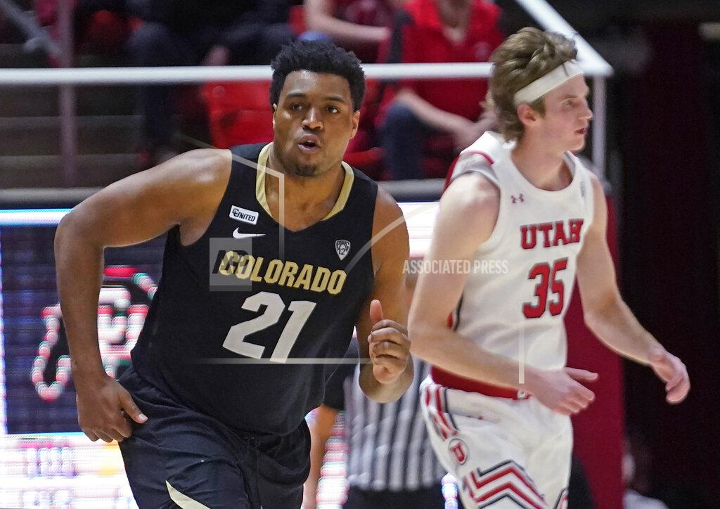 Rick Bowmer Colorado forward Evan Battey (21) runs upcourt after making a 3-pointer against Utah during the second half of an NCAA college basketball game Saturday, March 5, 2022, in Salt Lake City. (AP Photo/Rick Bowmer)