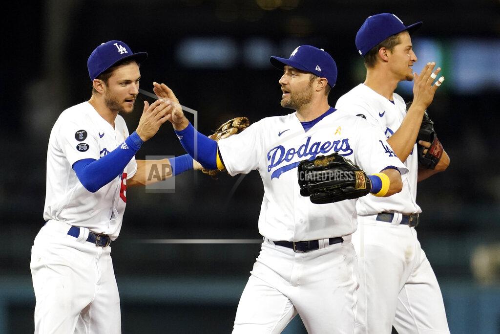 Marcio Jose Sanchez Los Angeles Dodgers' Trea Turner, AJ Pollock and Corey Seager, from left, celebrate the team's win over the Atlanta Braves in a baseball game Wednesday, Sept. 1, 2021, in Los Angeles. (AP Photo/Marcio Jose Sanchez)