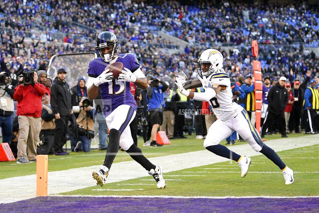 Nick Wass Baltimore Ravens wide receiver Michael Crabtree, left, scores a touchdown in front of Los Angeles Chargers cornerback Casey Hayward in the second half of an NFL wild card playoff football game, Sunday, Jan. 6, 2019, in Baltimore. (AP Photo/Nick Wass)