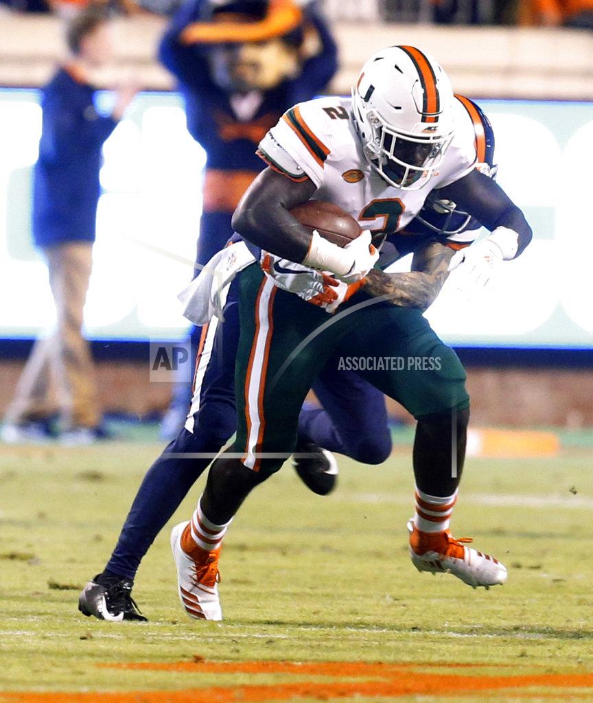 Steve Helber Miami defensive back Trajan Bandy (2) hauls in an interception during the first half of an NCAA college football game against Virginia in Charlottesville, Va., Saturday, Oct. 13, 2018. (AP Photo/Steve Helber)