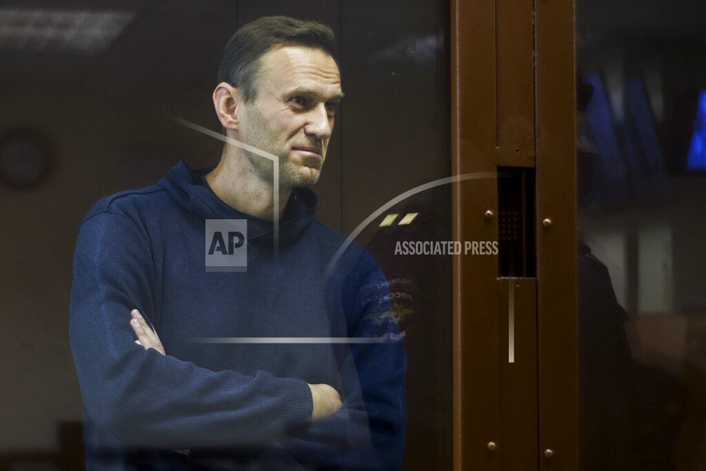 Uncredited In this photo provided by the Babuskinsky District Court, Russian opposition leader Alexei Navalny stands in a cage during a hearing on his charges for defamation, in the Babuskinsky District Court in Moscow, Russia, Friday, Feb. 5, 2021. Russian opposition leader Alexei Navalny appeared in a Moscow court on Friday for the second time this week, this time on a charge of slandering a World War II veteran. The politician, who was ordered earlier this week to serve two years and eight months in prison, slammed the hearing as a "disgusting PR trial" intended by the Kremlin to disparage him. (Babuskinsky District Court Press Service via AP)