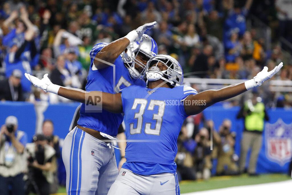 Rick Osentoski Detroit Lions running back Kerryon Johnson (33) celebrates his 1-yard touchdown run with teammate linebacker Jason Cabinda during the first half of an NFL football game against the Green Bay Packers, Sunday, Dec. 29, 2019, in Detroit. (AP Photo/Rick Osentoski)