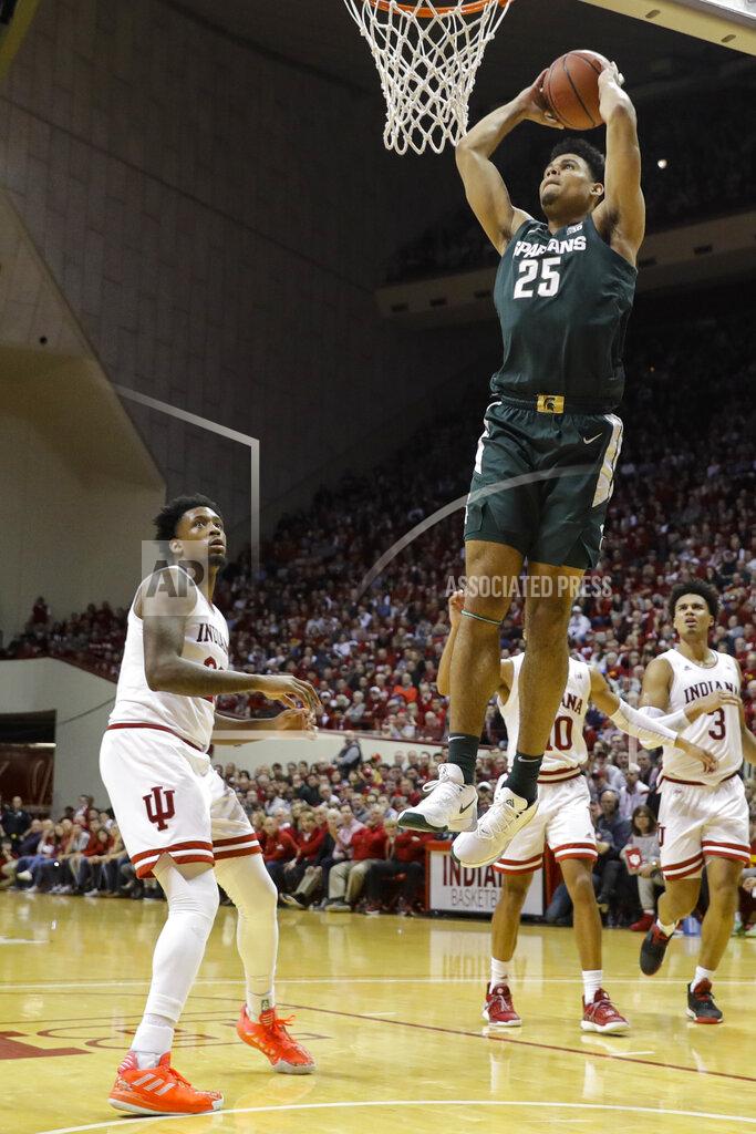 Darron Cummings Michigan State forward Malik Hall (25) goes up for a dunk in front of Indiana forward De'Ron Davis (20) in the second half of an NCAA college basketball game in Bloomington, Ind., Thursday, Jan. 23, 2020. (AP Photo/Darron Cummings)