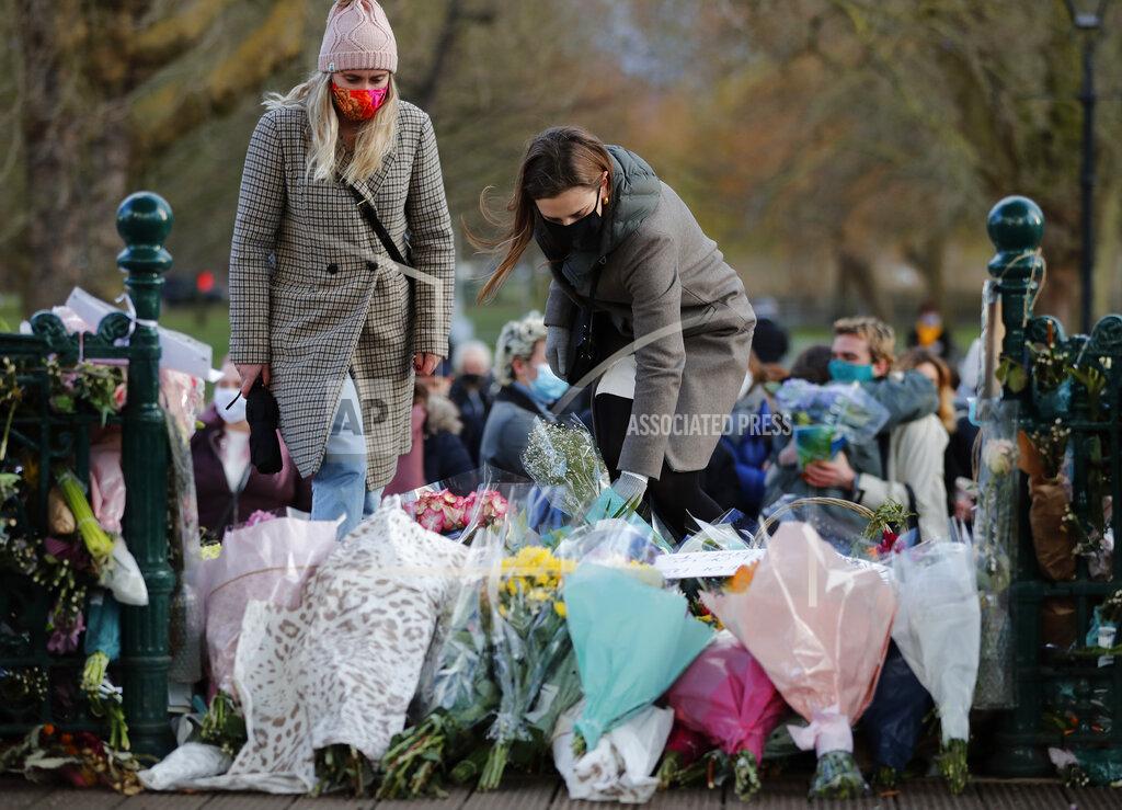 Frank Augstein People leave floral tributes, at the band stand in Clapham Common, after a vigil for Sarah Everard was officially cancelled, in London, Saturday, March 13, 2021. A serving British police officer accused of the kidnap and murder of a woman in London has appeared in court for the first time. Wayne Couzens, 48, is charged with kidnapping and killing 33-year-old Sarah Everard, who went missing while walking home from a friend’s apartment in south London on March 3. (AP Photo/Frank Augstein)