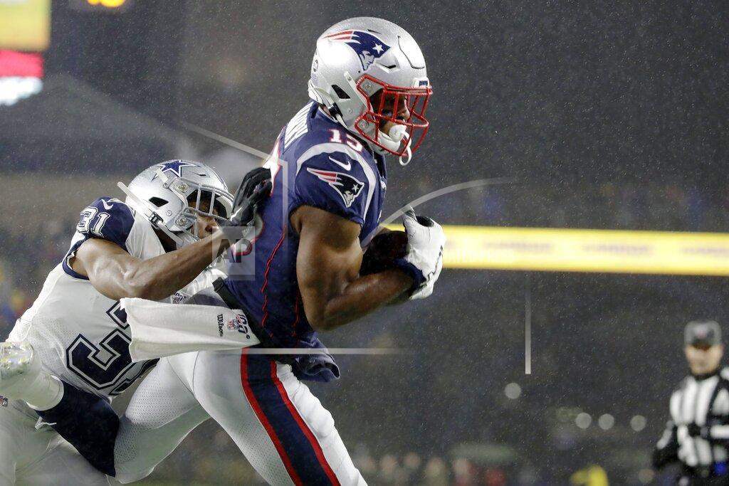 Elise Amendola New England Patriots wide receiver N'Keal Harry, right, catches a touchdown pass in the end zone as Dallas Cowboys cornerback Byron Jones tries to defend in the first half of an NFL football game, Sunday, Nov. 24, 2019, in Foxborough, Mass. (AP Photo/Elise Amendola)