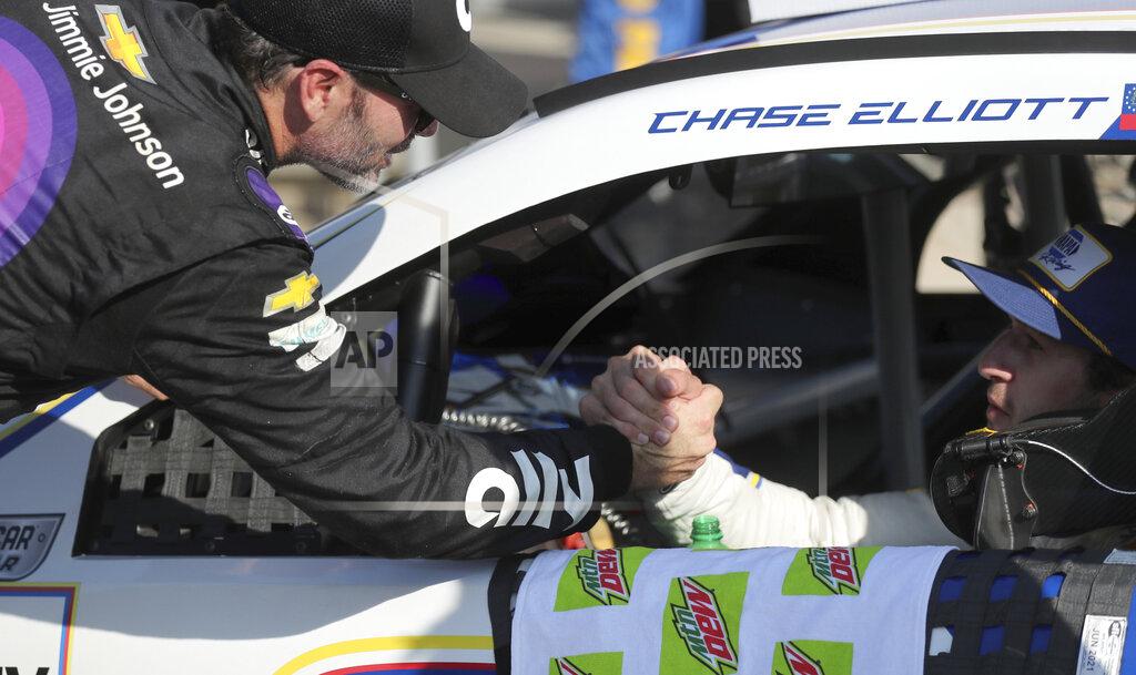 John Munson Jimmie Johnson, who finished in 19th place, congratulates race winner Chase Elliott after the NASCAR Cup Series auto race at Watkins Glen International, Sunday, Aug. 4, 2019, in Watkins Glen, N.Y. (AP Photo/John Munson)