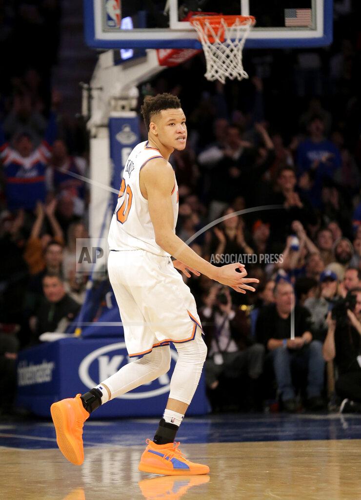 Seth Wenig New York Knicks' Kevin Knox reacts after hitting a three-point basket during the second half of the NBA basketball game against the Philadelphia 76ers, Sunday, Jan. 13, 2019, in New York. (AP Photo/Seth Wenig)