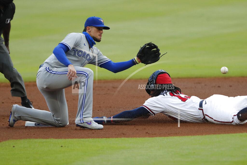 John Bazemore Atlanta Braves' Ronald Acuna Jr. (13) steals second base ahead of the throw to Toronto Blue Jays second baseman Cavan Biggio (8) in the first inning of a baseball game Tuesday, Aug. 4, 2020, in Atlanta. (AP Photo/John Bazemore)